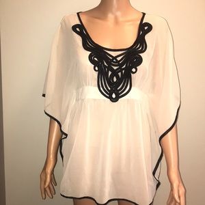 Sheer cream top with black trim butterfly sleeves
